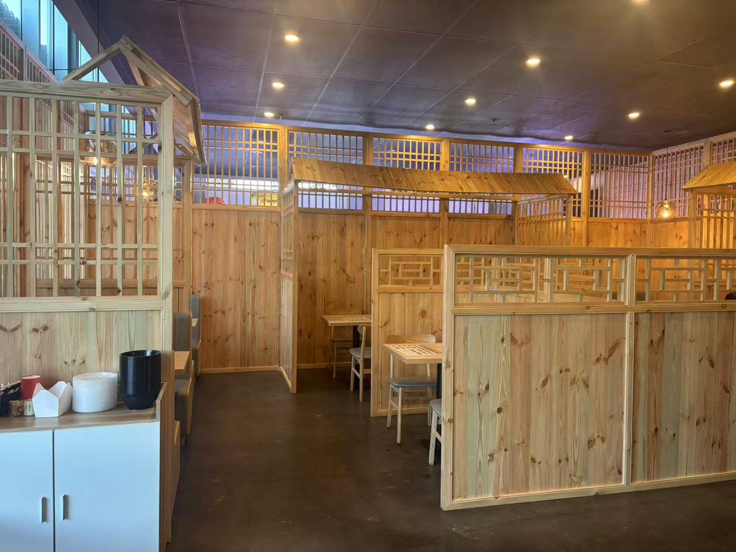 Wooden partitioned dining area with traditional-style decor at Dough valley, a Ramen Restaurant in Oregon City